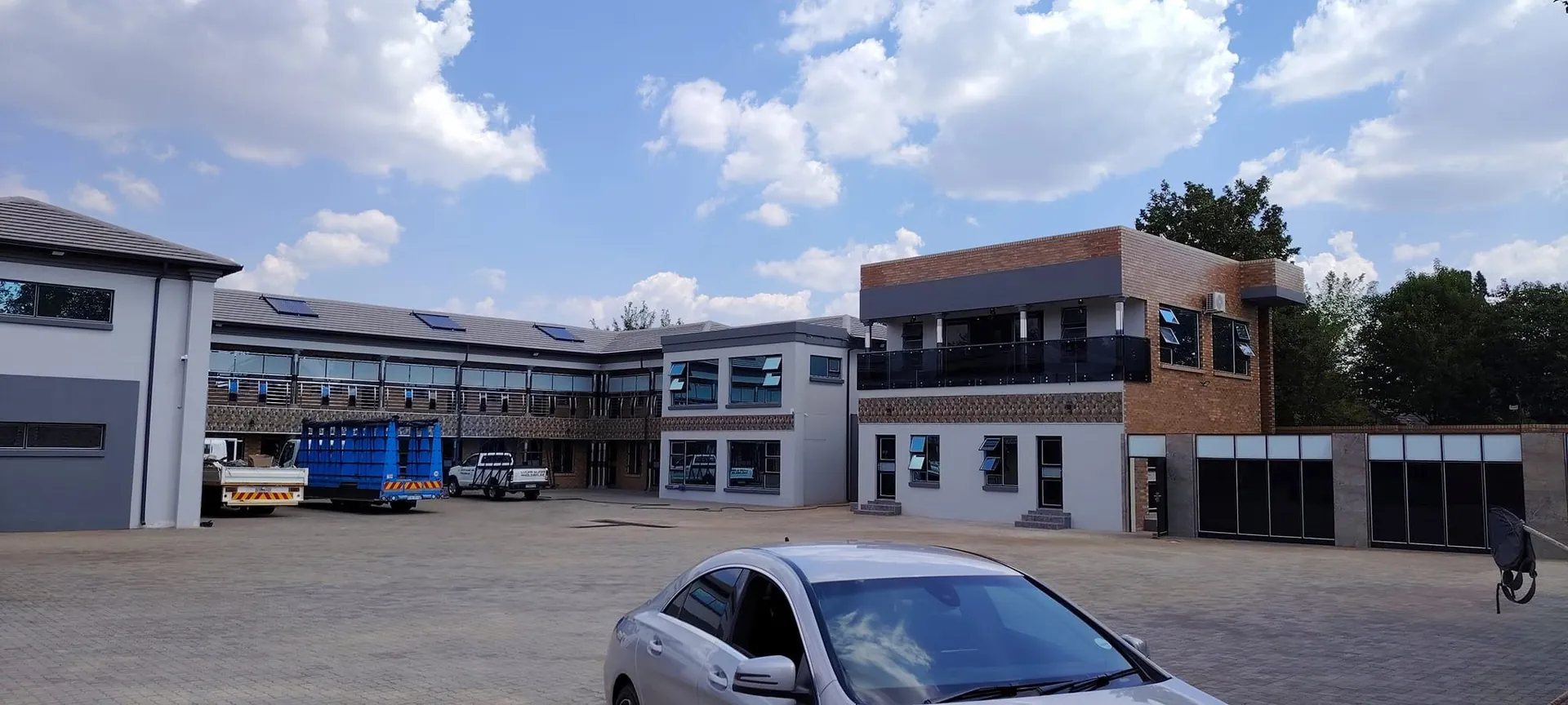 Commercial office complex fitted with aluminium windows and a black balcony balustrade