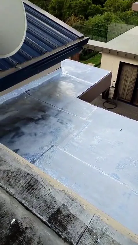Torch-on waterproofing taken up and over the parapet edges of a flat roof